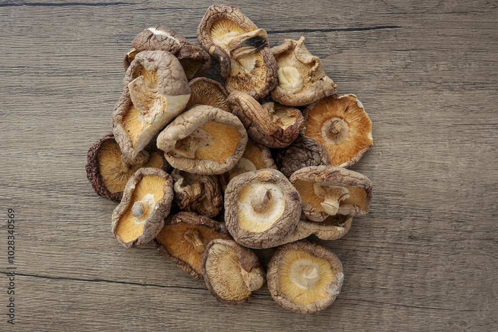 Dried mushrooms , Deied shiitake mushrooms on wooden background Dried mushrooms , Deied shiitake mushrooms on wooden background
