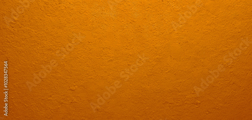 Vibrant orange wall with a textured plaster feel. Premium wall photo with classic old and retro nuances, Background for website or banner.