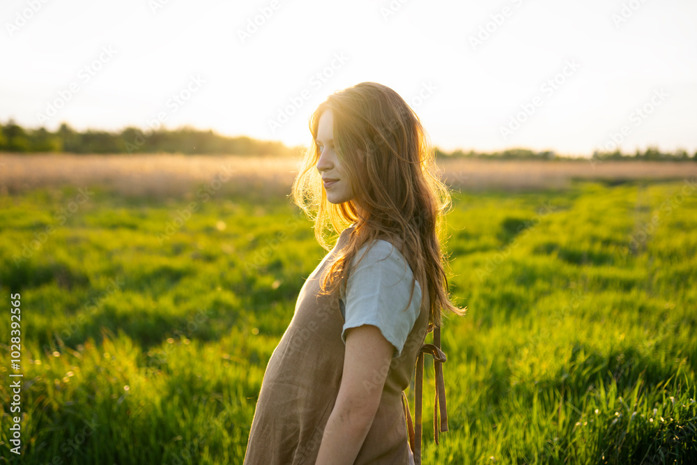 Blond beautiful woman standing in meadow Blond beautiful woman standing in meadow