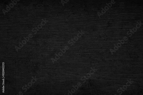 Grunge textured black paper background with rough surface for vintage design.