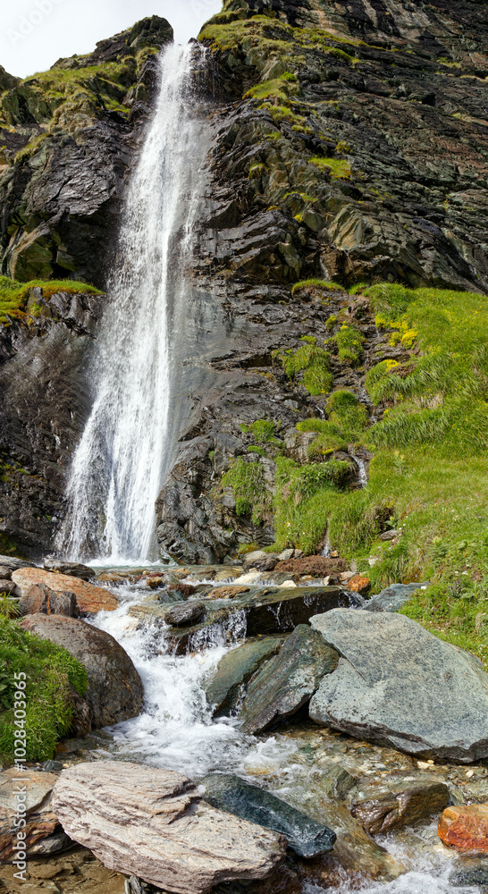 Vertical mountain panorama, waterfall in the Alps, Lombardy, Italy, Europe Vertical mountain panorama, waterfall in the Alps, Lombardy, Italy, Europe