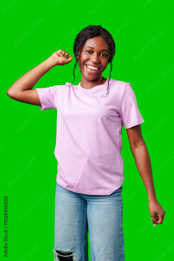 Joyful woman celebrating success with clenched fists against a bright green background Joyful woman celebrating success with clenched fists against a bright green background