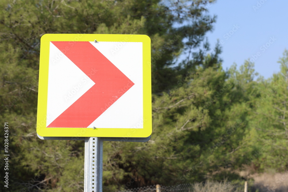 red chevron signs indicating dangerous curve red chevron signs indicating dangerous curve