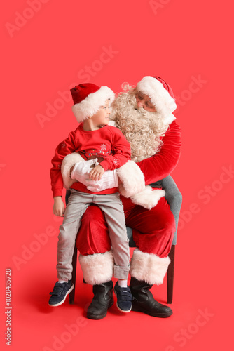 Santa Claus and cute little...