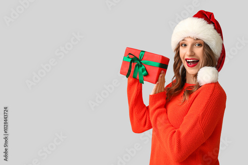 Happy young woman in Santa ...