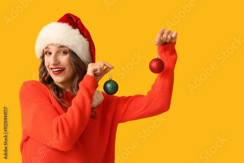 Young woman in Santa hat wi...