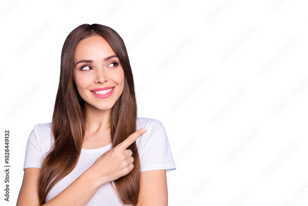 Close up photo of lovely youth pointing at copy space looking smiling wearing white t-shirt isolated over blue background Close up photo of lovely youth pointing at copy space looking smiling wearing white t-shirt isolated over blue background
