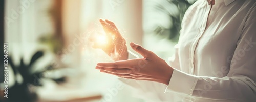 Wallpaper Mural A person presenting a glowing orb between their hands, symbolizing creativity and innovative ideas in a bright, modern environment. Torontodigital.ca