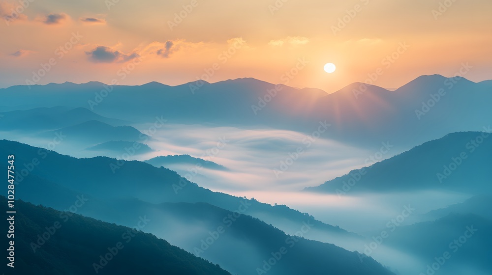 Fog rolling over a mountain range at dawn, with the sun barely visible through the mist Fog rolling over a mountain range at dawn, with the sun barely visible through the mist