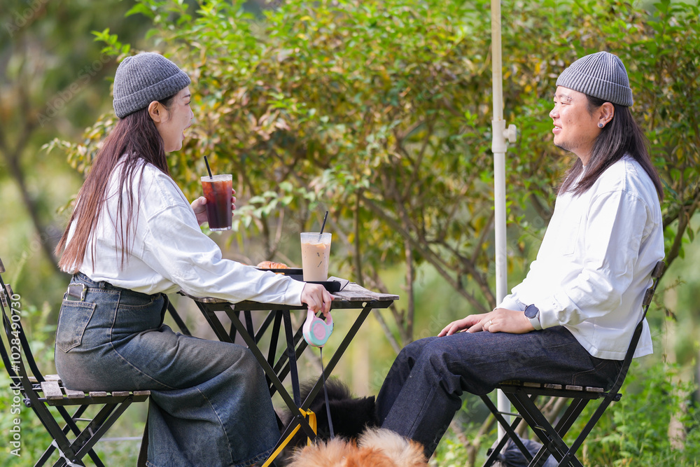A Korean man and a Japanese woman, both in their 30s and a married couple, are enjoying an autumn brunch with three dogs at a stylish cafe located in Gyeongchun-ro, Namyangju-si, Gyeonggi-do, Korea. A Korean man and a Japanese woman, both in their 30s and a married couple, are enjoying an autumn brunch with three dogs at a stylish cafe located in Gyeongchun-ro, Namyangju-si, Gyeonggi-do, Korea.