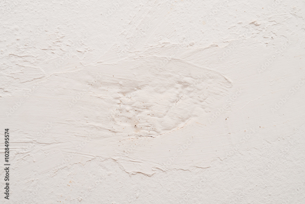White plastered wall with visible texture, rough surface, and irregular patterns, showcasing an abstract design. White plastered wall with visible texture, rough surface, and irregular patterns, showcasing an abstract design.