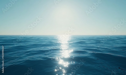 A blue ocean with sunlight shining through the water surface