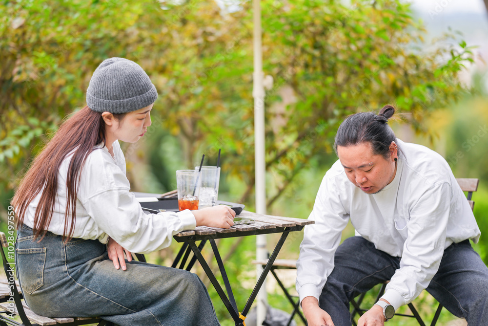 A Korean man and a Japanese woman, both in their 30s and a married couple, are enjoying an autumn brunch with three dogs at a stylish cafe located in Gyeongchun-ro, Namyangju-si, Gyeonggi-do, Korea. A Korean man and a Japanese woman, both in their 30s and a married couple, are enjoying an autumn brunch with three dogs at a stylish cafe located in Gyeongchun-ro, Namyangju-si, Gyeonggi-do, Korea.