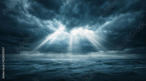 Sun rays breaking through dark storm clouds over the ocean, dramatic weather, hope after the storm