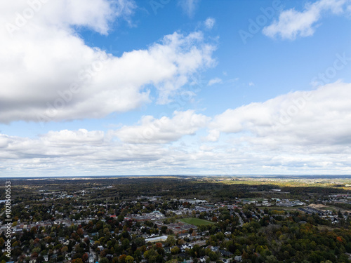 Aerial view of small islands dotting the calm waters of the Thousand Islands region, showcasing the scenic landscape and natural beauty of the Canadian side.