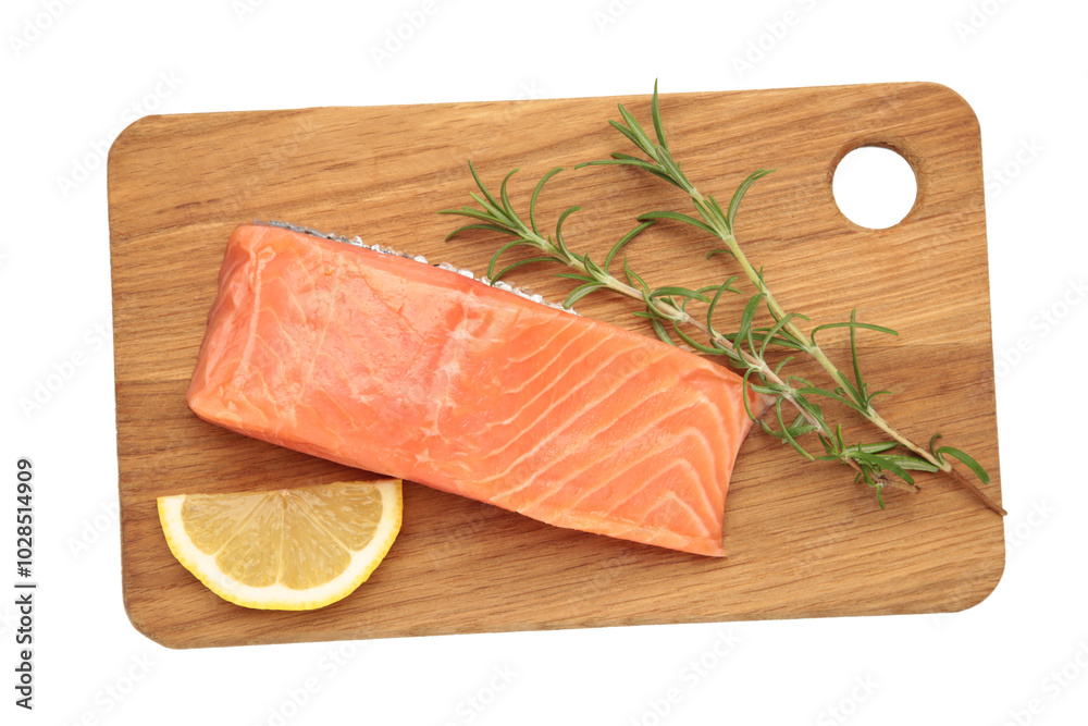 Red fish. Raw salmon fillet with rosemary and lemon on cutting board isolated on white Red fish. Raw salmon fillet with rosemary and lemon on cutting board isolated on white