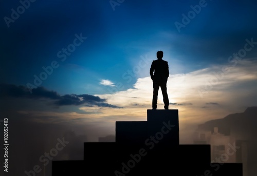 A silhouette of a man standing on a platform, with a cloudy sky behind him.