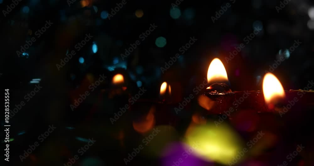 Oil lamp with warm flickering light, colorful blurred lights in background, serene and festive scene Oil lamp with warm flickering light, colorful blurred lights in background, serene and festive scene