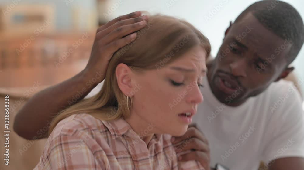 Close up of African Man Consoling Depressed Crying Wife