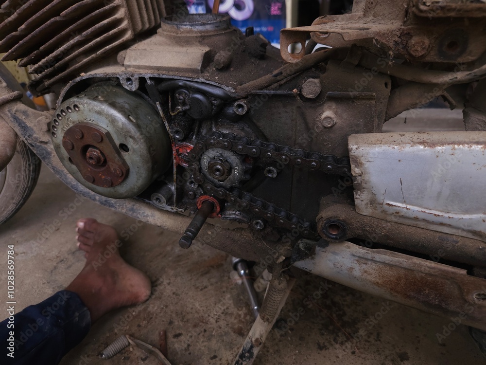 Close-up of mechanic repairing motorcycle. Close-up of mechanic repairing motorcycle.