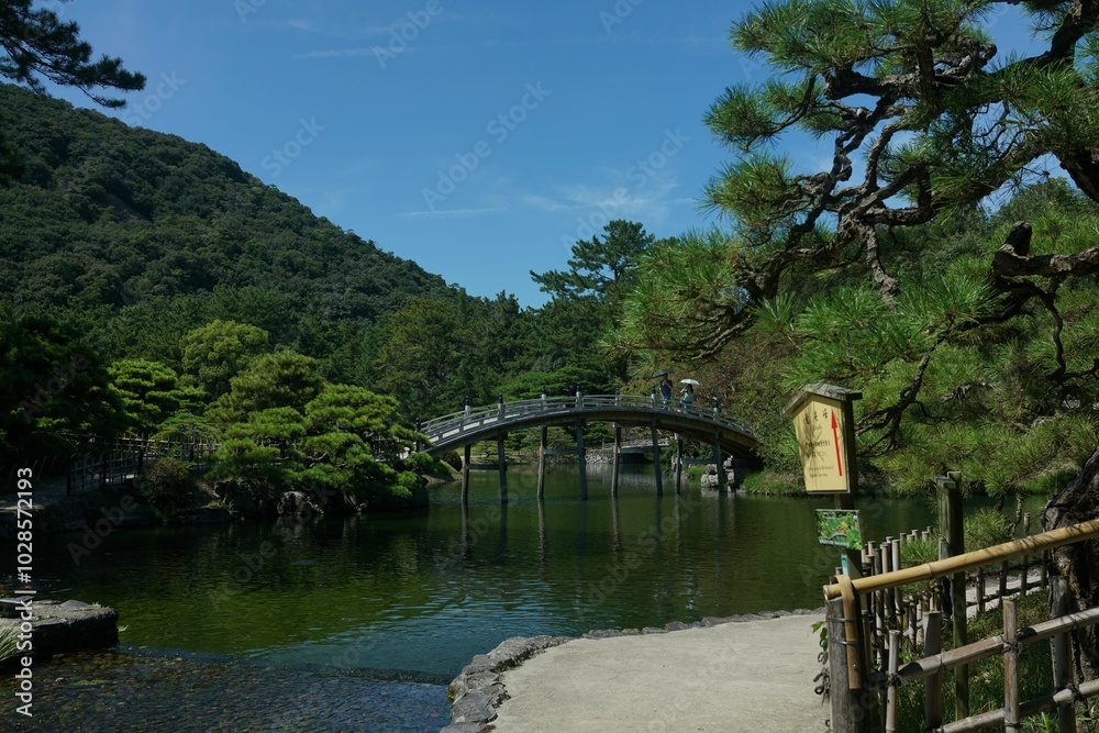 Scenic view of a traditional Japanese garden in Takamatsu, Japan Scenic view of a traditional Japanese garden in Takamatsu, Japan