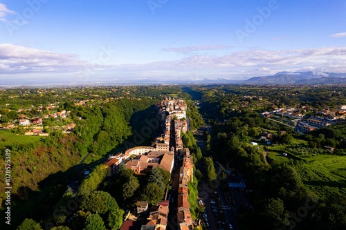 Aerial view of small narrow village surrounded by green valley in Zagarolo, Rome photo