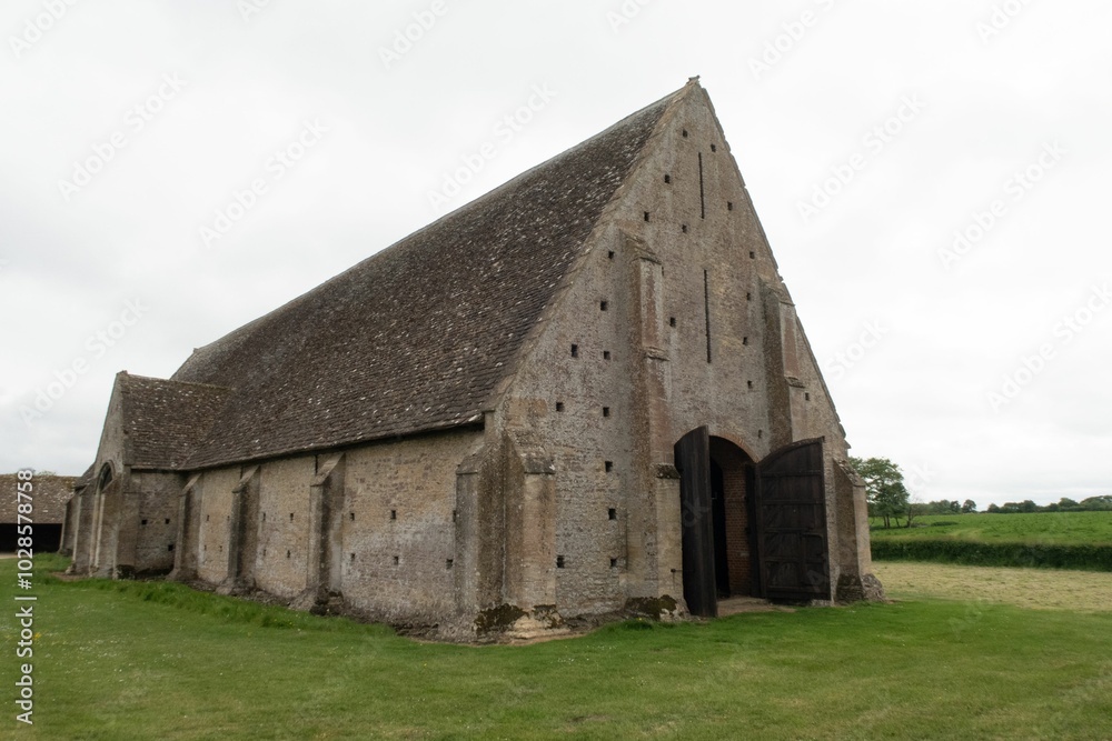 Historic stone barn in rural landscape. Historic stone barn in rural landscape.