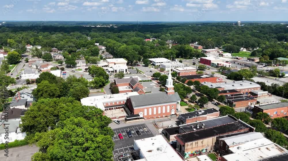 Church steeple, rooftops, and a surrounding green landscape at Morrisville, North Carolina, USA Church steeple, rooftops, and a surrounding green landscape at Morrisville, North Carolina, USA
