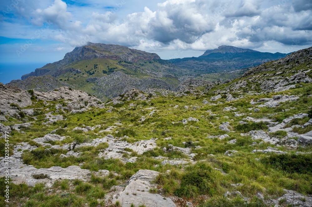 Scenic mountainous landscape with lush greenery and cloudy sky. Scenic mountainous landscape with lush greenery and cloudy sky.