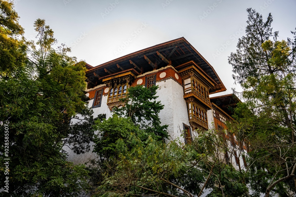 Traditional Bhutanese Building Surrounded by Greenery Traditional Bhutanese Building Surrounded by Greenery