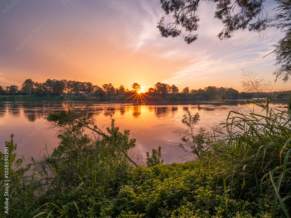 Obraz premium Sunset Over The River