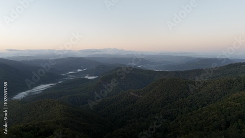 Panoramic view of lush green mountains at sunrise