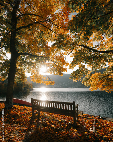 Obraz na płótnie Beautiful fall scenery in Zell am See, Austria with bench, golden foliage and ship on a lake, Salzburg Land, Austria w salonie