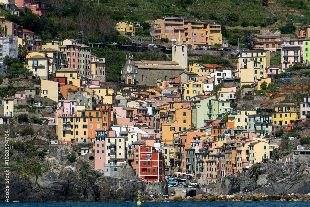 Scenic view of Monterosso al Mare beach with vibrant blue water and historic buildings in Italy Scenic view of Monterosso al Mare beach with vibrant blue water and historic buildings in Italy
