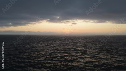 Wallpaper Mural Aerial footage of the open ocean, with a scenic cloudy dusk sky in the background Torontodigital.ca