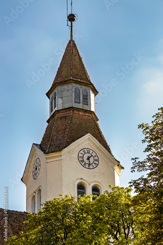 The tower and fortified church of Bunesti in Romania photo