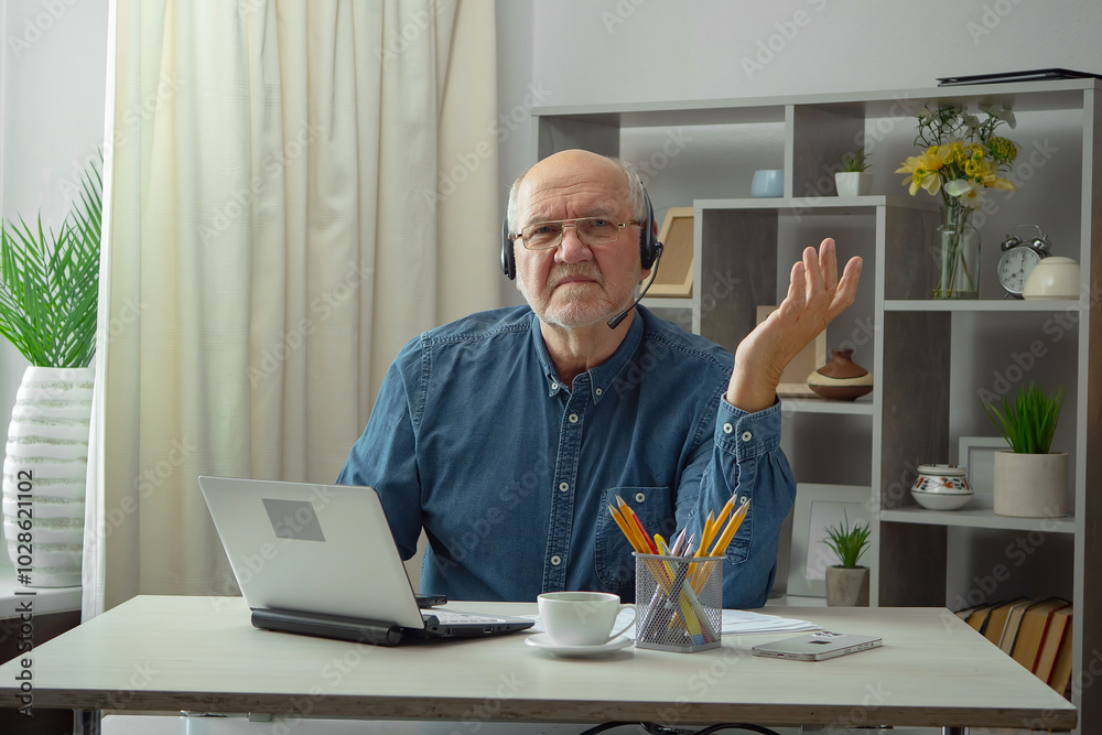 An elderly man, a doctor, in his office, at a table. An elderly man, a doctor, in his office, at a table.