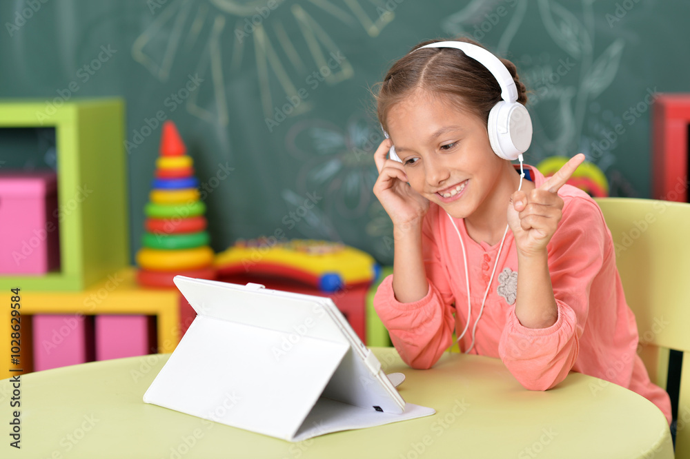 Cute little woman with tablet and headphones Cute little woman with tablet and headphones