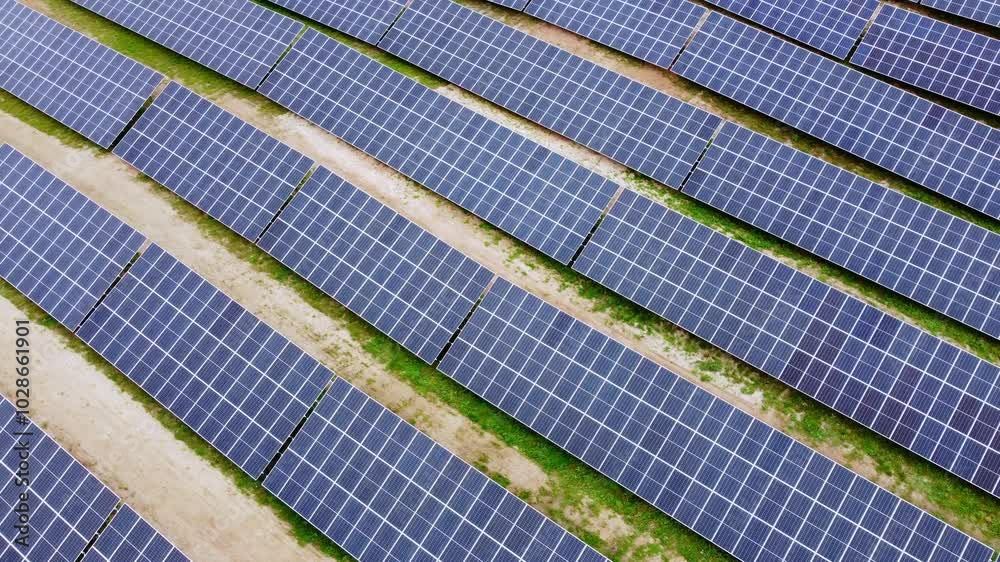 Huge solar panel farm to produce green energy, aerial orbit view