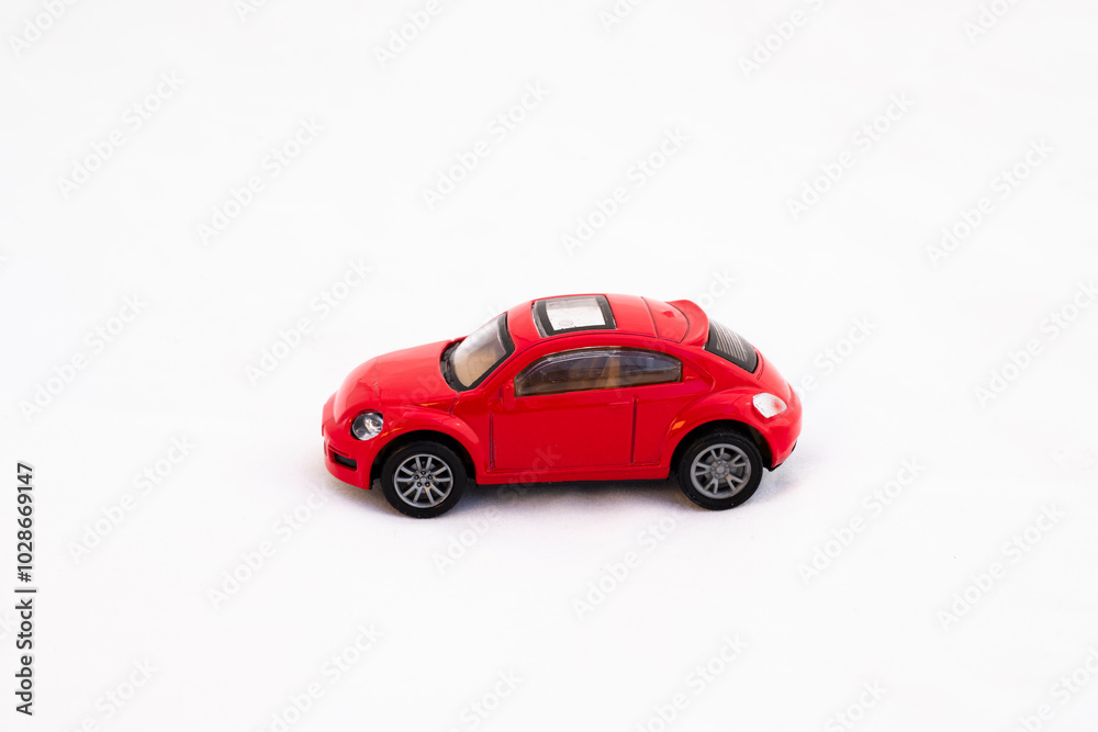 Small miniature toy model car side view on white background Small miniature toy model car side view on white background