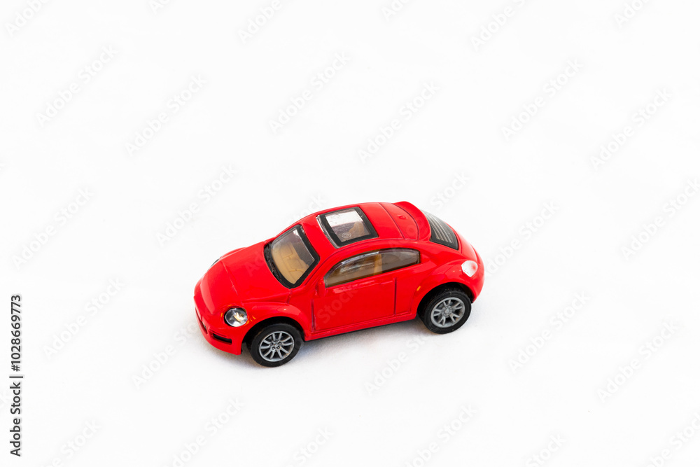 Red toy car on white isolated background with copy space Red toy car on white isolated background with copy space