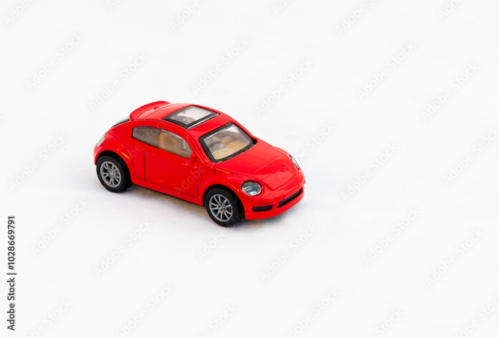 Red toy car front view on white isolated background with copy space Red toy car front view on white isolated background with copy space