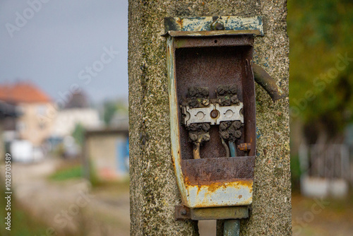 Electricity distribution box. dangerous switch box. unprotected state. devastation, destruction of the old railway lamp at the railway station. photo