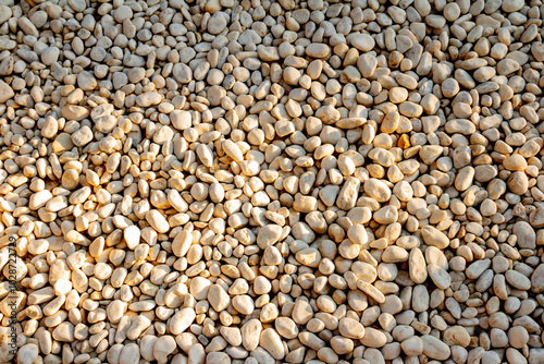 White pebble stones background texture. Close up of stone pebbles.