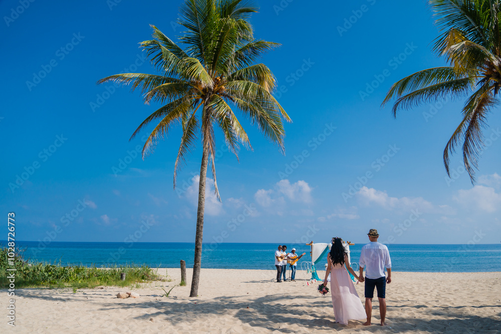 Three black musicians dressed in suits are standing on caribbean coastline and playing musical instruments guitar, drums, violin near arch at wedding ceremony
Three black musicians dressed in suits are standing on caribbean coastline and playing musical instruments guitar, drums, violin near arch at wedding ceremony