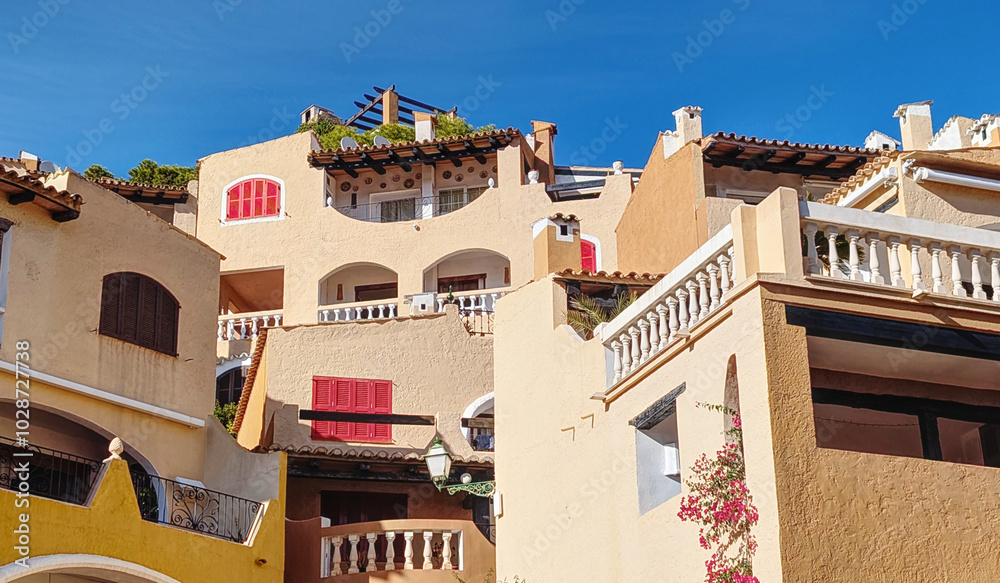 Mediterranean houses at the idyllic small town of Cala Fornells on Majorca island, Mediterranean architecture on Spain Mediterranean Sea, Balearic Islands. Mediterranean houses at the idyllic small town of Cala Fornells on Majorca island, Mediterranean architecture on Spain Mediterranean Sea, Balearic Islands.