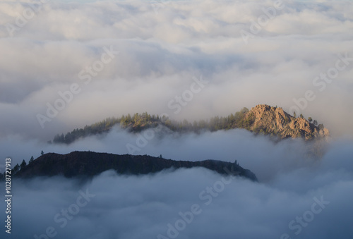 Morro de la Cruz Grande in a sea of clouds. The Nublo Rural Park. San Bartolome de Tirajana. Gran Canaria. Canary Islands. Spain. photo