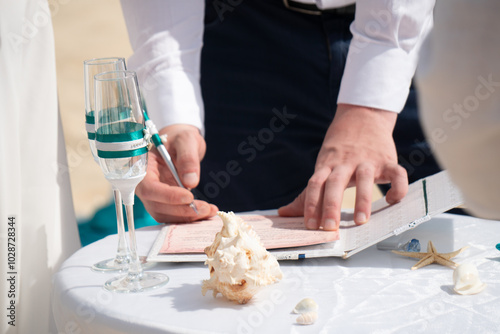 Decorations for wedding in the beach, Accessory kit bottles with sand for a wedding is on the table on the coastline of caribbean sea