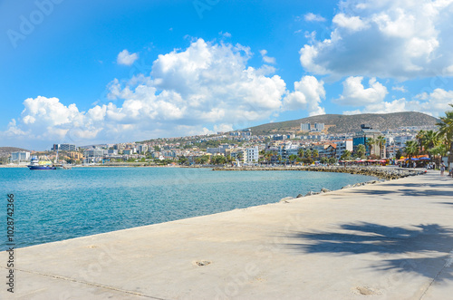Fototapeta Naklejka Na Ścianę i Meble -  Kusadasi, Turkey - 12.09.2024: Beach promenade in the Turkish coastal town of Kusadasi.