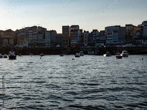 Boats moored on buoys in Galicia photo